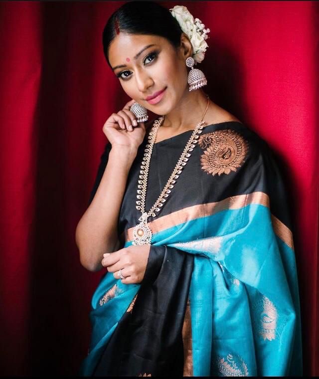 Regal Banarasi Soft Silk Saree adorned with Stunning Zari Weaving in Black and Blue